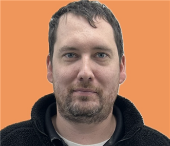 man in front of orange background