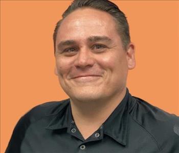 man in front of orange background