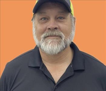 man in front of orange background