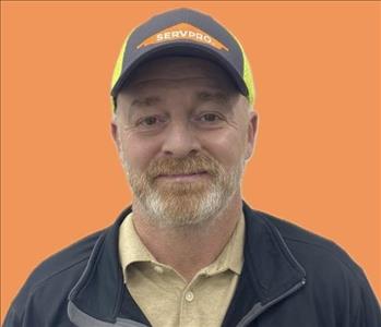 man in front of orange background